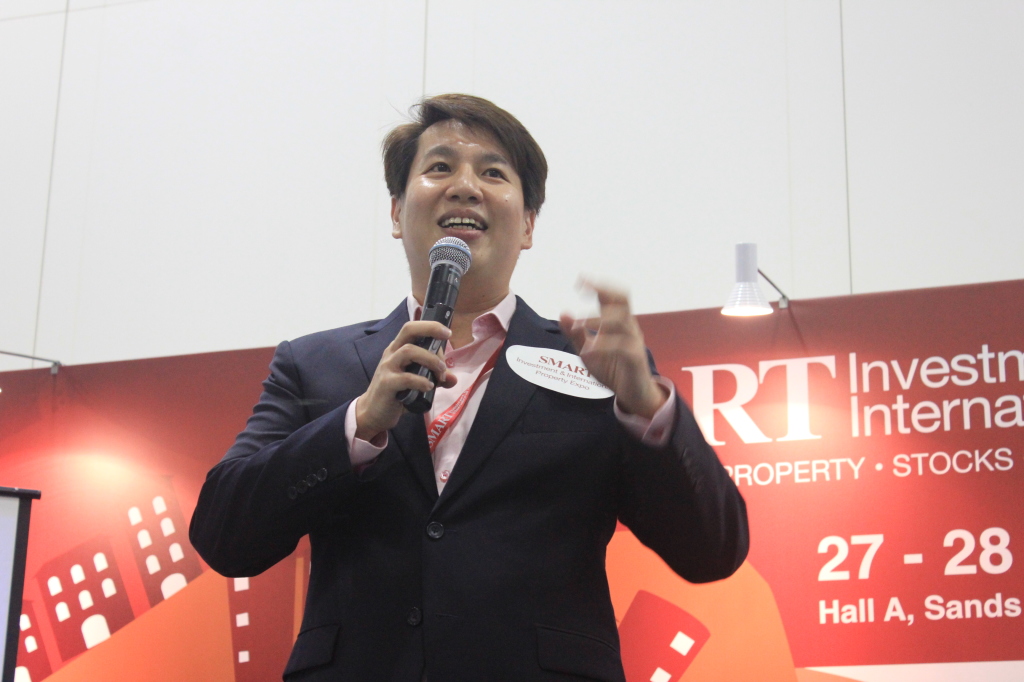 Collin Seow speaking at an investment event